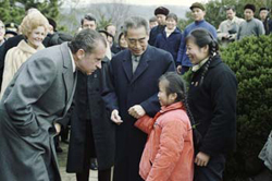 Nixon greets a young Chinese girl in Hangchow, February 27, 1972